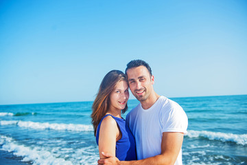 Fototapeta na wymiar Young happy couple on seashore.
