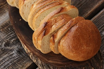 Delicious fresh loaf on a wooden table 