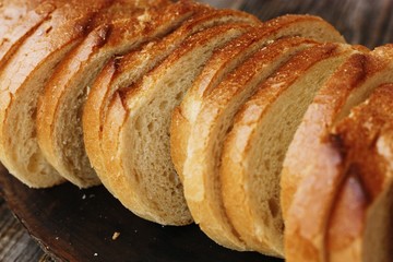 Delicious fresh loaf on a wooden table 