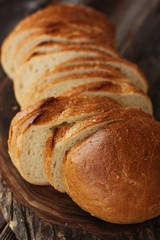Delicious fresh loaf on a wooden table 