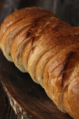 Delicious fresh loaf on a wooden table 