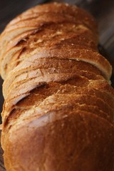 Delicious fresh loaf on a wooden table 