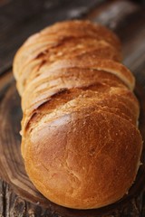 Delicious fresh loaf on a wooden table 