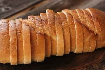 Delicious fresh loaf on a wooden table 
