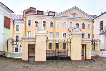 Fototapeta premium Mogilev, Belarus - March 2020. Beautiful old town in Mogilev city, Belarus. Town hall. Mogilev landmark, cultural heritage. City street with historical building.