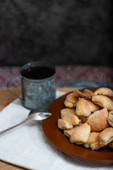 Crispy cottage cheese cookies lies on a brown plate