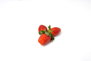 Red and fresh strawberries isolated on white