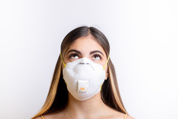 person wearing a protective face mask looking up