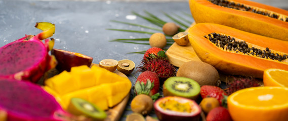 Exotic fruits and tropical leaves