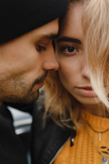 Close up portrait of man in the hat and blonde woman