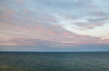 Fototapeta premium Calm sea and clouds over it