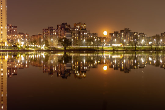 Night city Kiev is reflected in the water.