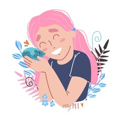 little girl holding a hamster in her arms