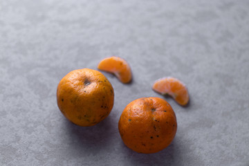 Fresh orange slices with nice textured background.
