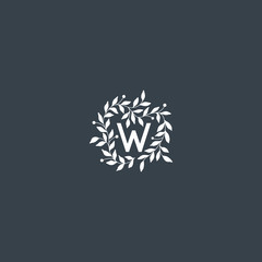 Hand drawn vector floral frame with "W" letter. Elegant floral monogram for "W".