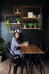 A woman sitting with Iced cocoa in her hand