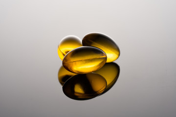 Fish oil (omega 3) cabsules on black background