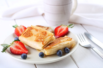 Pancakes with berries and juice