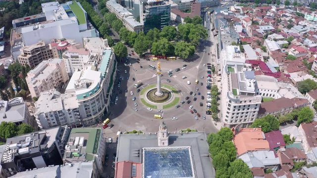 flight over Freedom Square and Liberty Monument Depicting St George Slaying The Dragon And Tbilisi City Hall In City Center. Famous Landmark. Tbilisi, Georgia.