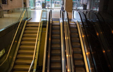 Escalators in an empty office lobby
