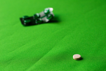 photo open green pack of pills lies on a green background next to the tablet