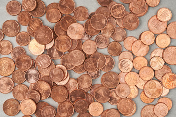 pile of coins on concrete background