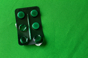 photo pills on a green background