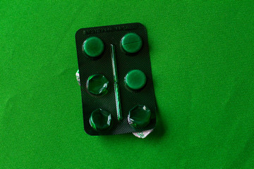 photo open green pack of pills