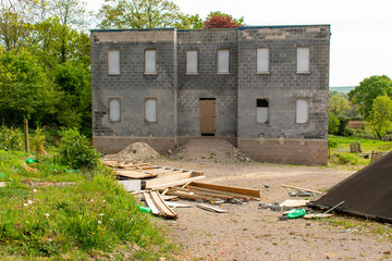 An abandoned and derelict property situated in the lush green rural English countryside in the...