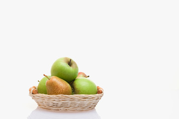 Apples and pears in a basket on a white background