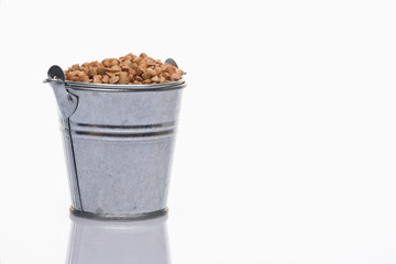 Bucket of rice on a white background