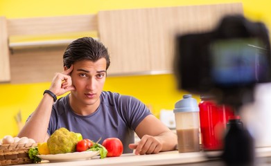 Young man blogging about food supplements