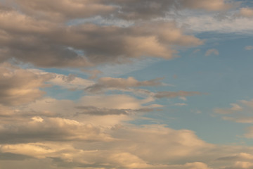 View of interesting golden yellow clouds over the Austrian Alps
