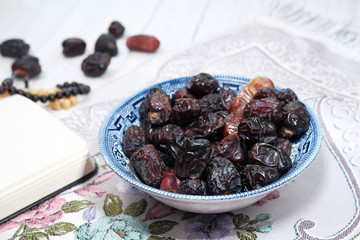 the concept of ramadan, close up of date fruit in a bowl