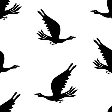 Seamless background of silhouettes flying birds