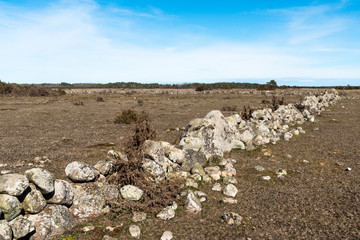 Broken dry old traditional stonewall