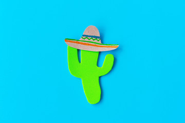 Cinco de Mayo with a Mexican cactus and a sombrero hat on a blue background. Fiesta, usa, mexican holiday