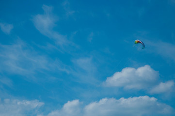 Fototapeta na wymiar Colorful kite is flying in the sky