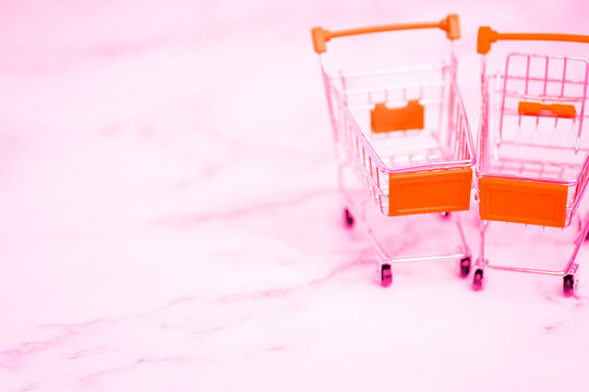 Shopping trolleys on light background