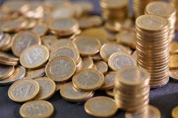 Stock Photo - Euro coins. Euro money. Euro currency.Coins stacked on each other in different positions. Money concept