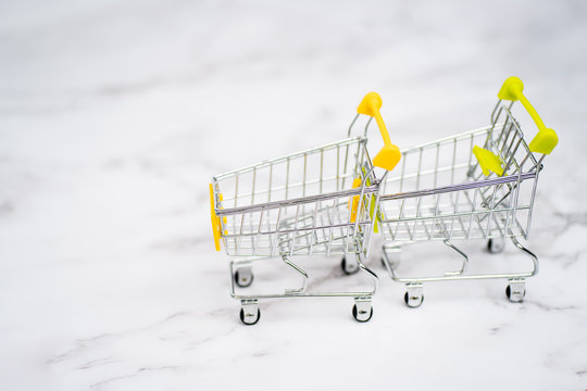 Shopping trolleys on light background
