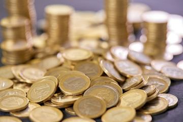 Stock Photo - Euro coins. Euro money. Euro currency.Coins stacked on each other in different positions. Money concept