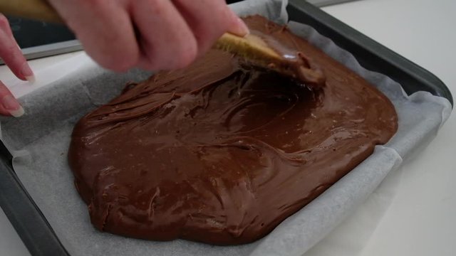 Home Cook Making Chocolate Fudge In A Cast Iron Pan In A Personal Kitchen