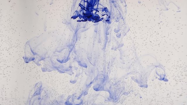 flat bottle and additional blue ink dissolving in water