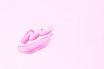 close up of a smudged lipstick on white background