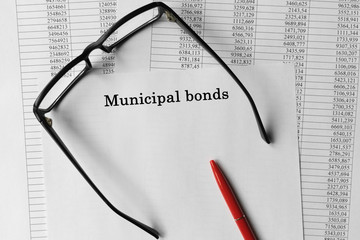 Paper with Municipal bonds on the table.