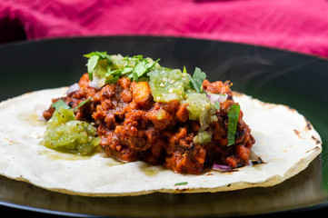 Vegetarian vegan tacos al pastor with green salsa