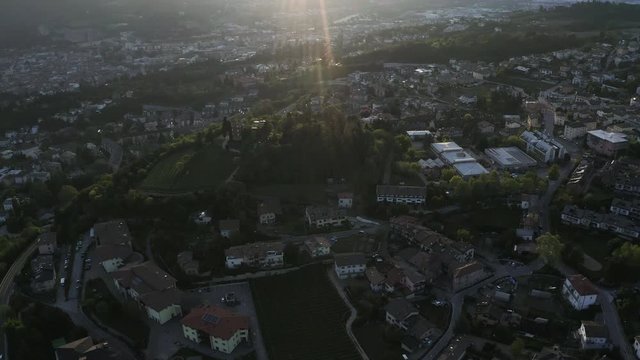 Italy, Trento, 01 May 2019: Panorama of the city at sunset, facade of buildings, Picturesque view of mountains through evening smoke