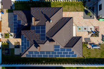 New House with garden and solar panels on the roof © volody10