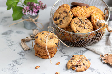 Chocolate Chip Cookies. Homemade baking. Round shape, not big. On a light gray background.